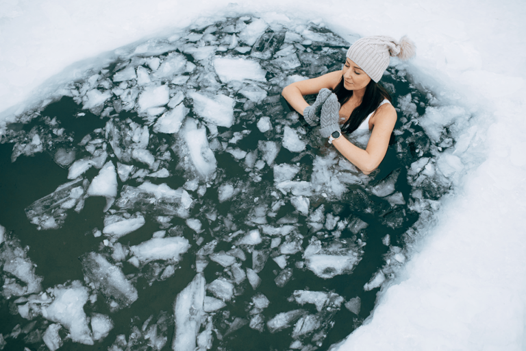 woman cold plunge icy lake