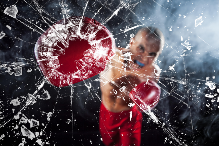 boxer punching through glass